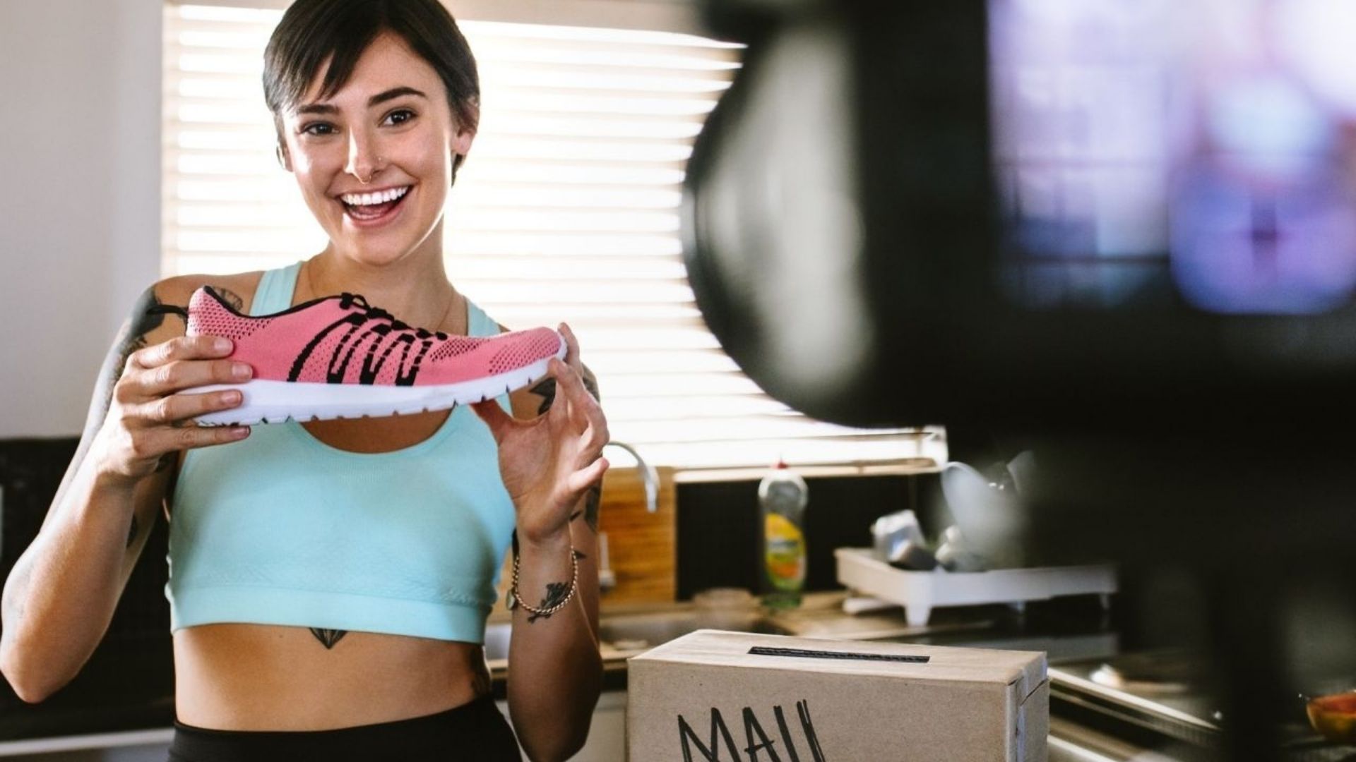 Influencer holding a pink adidas