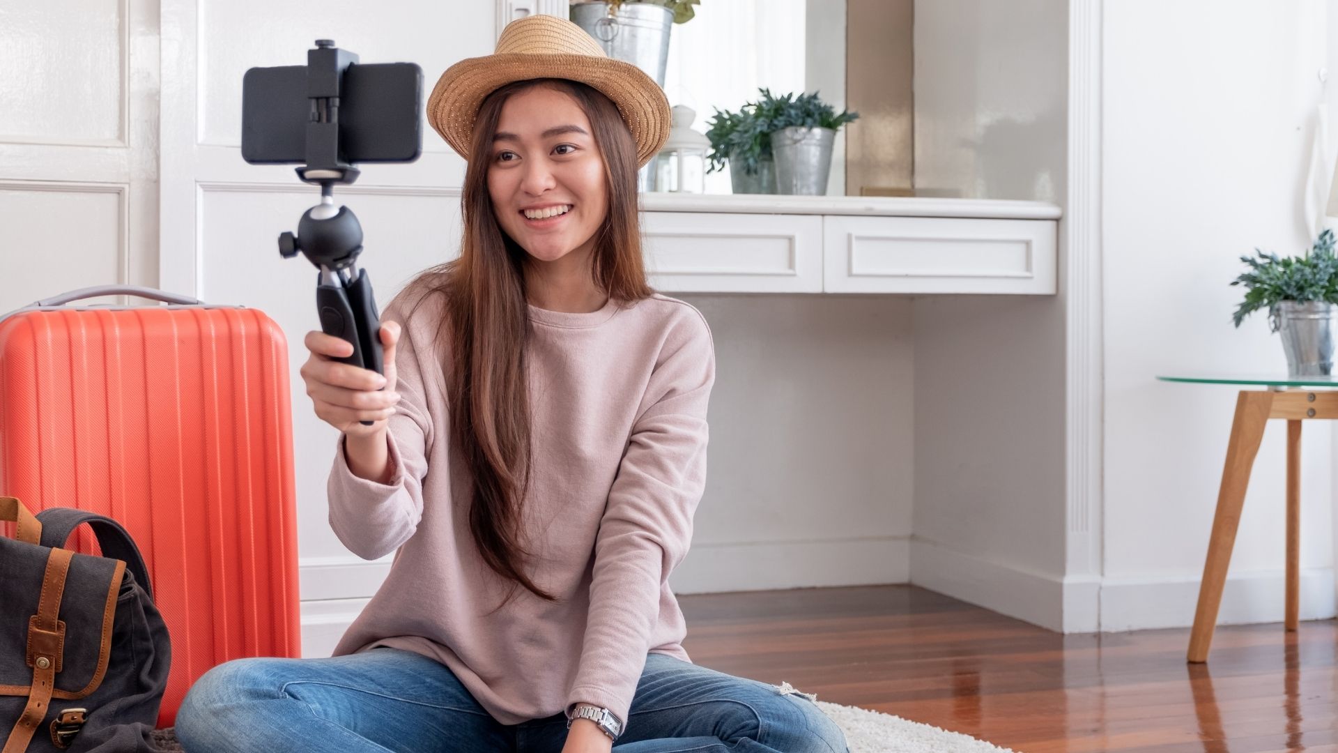 Influencer with hat filming herself